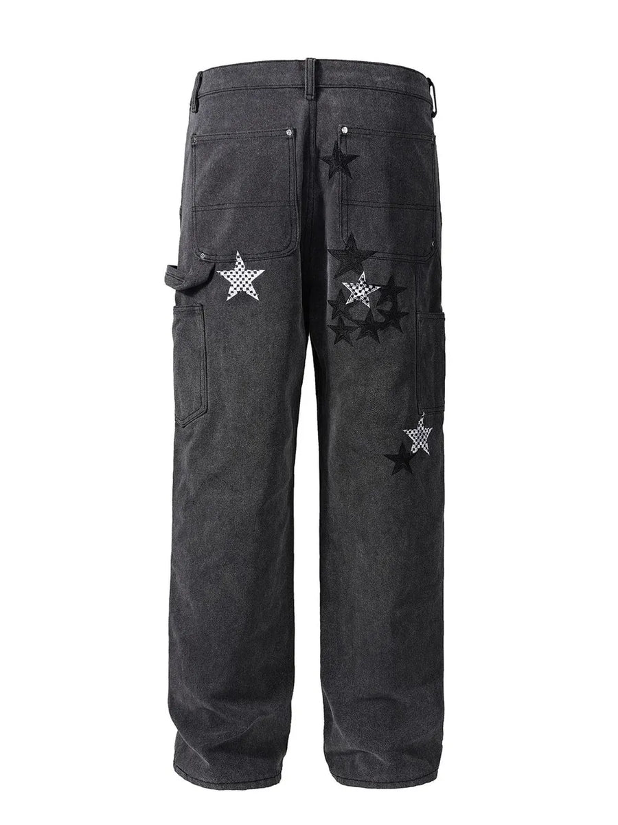 Dark embroidered star carpenter jeans with checkered pattern details.