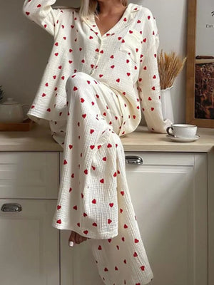 red pajama set featuring buttoned and heart print