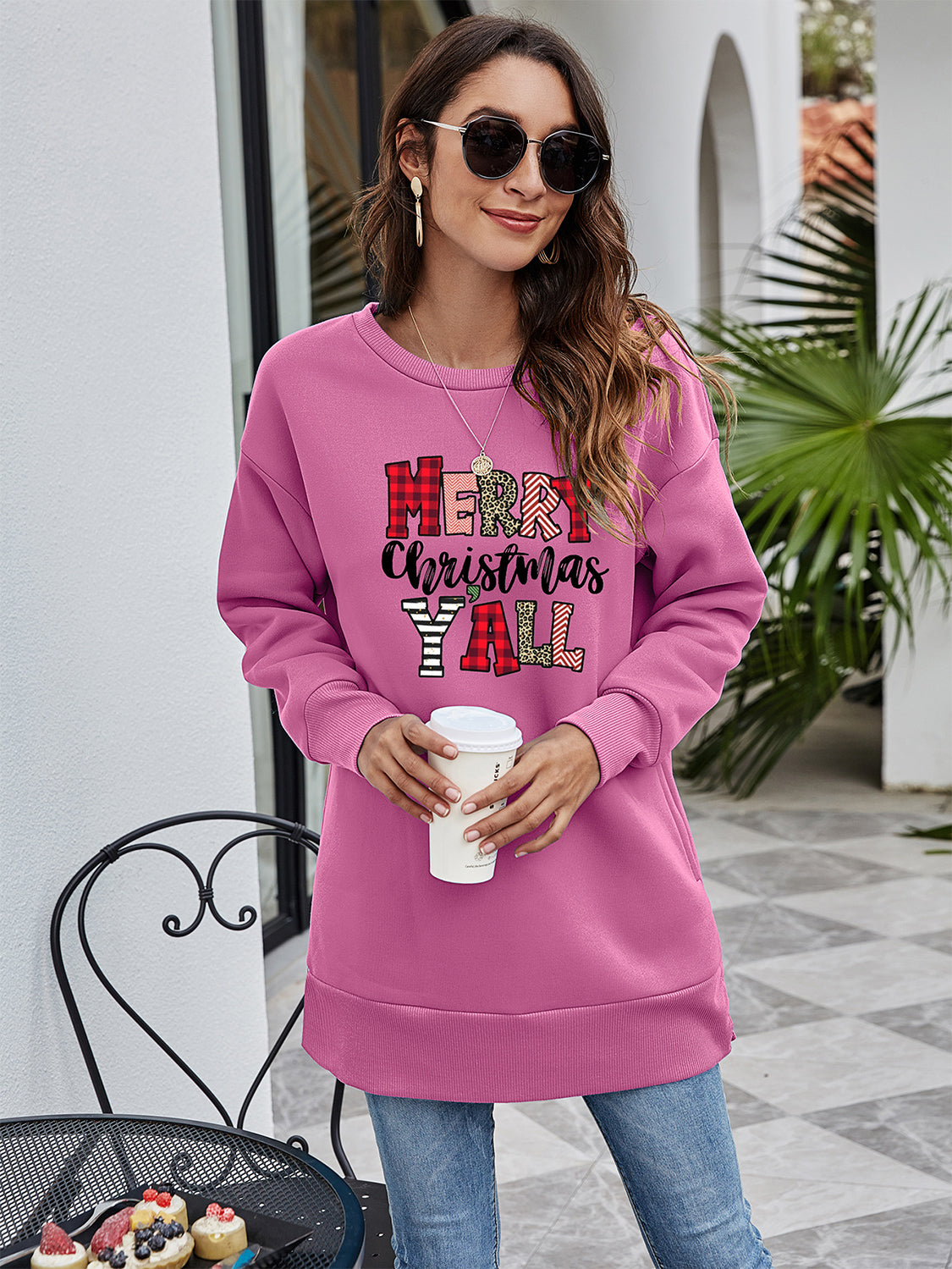 Oversized pink sweatshirt with Merry Christmas Y'all graphic, crew neck, long sleeves.