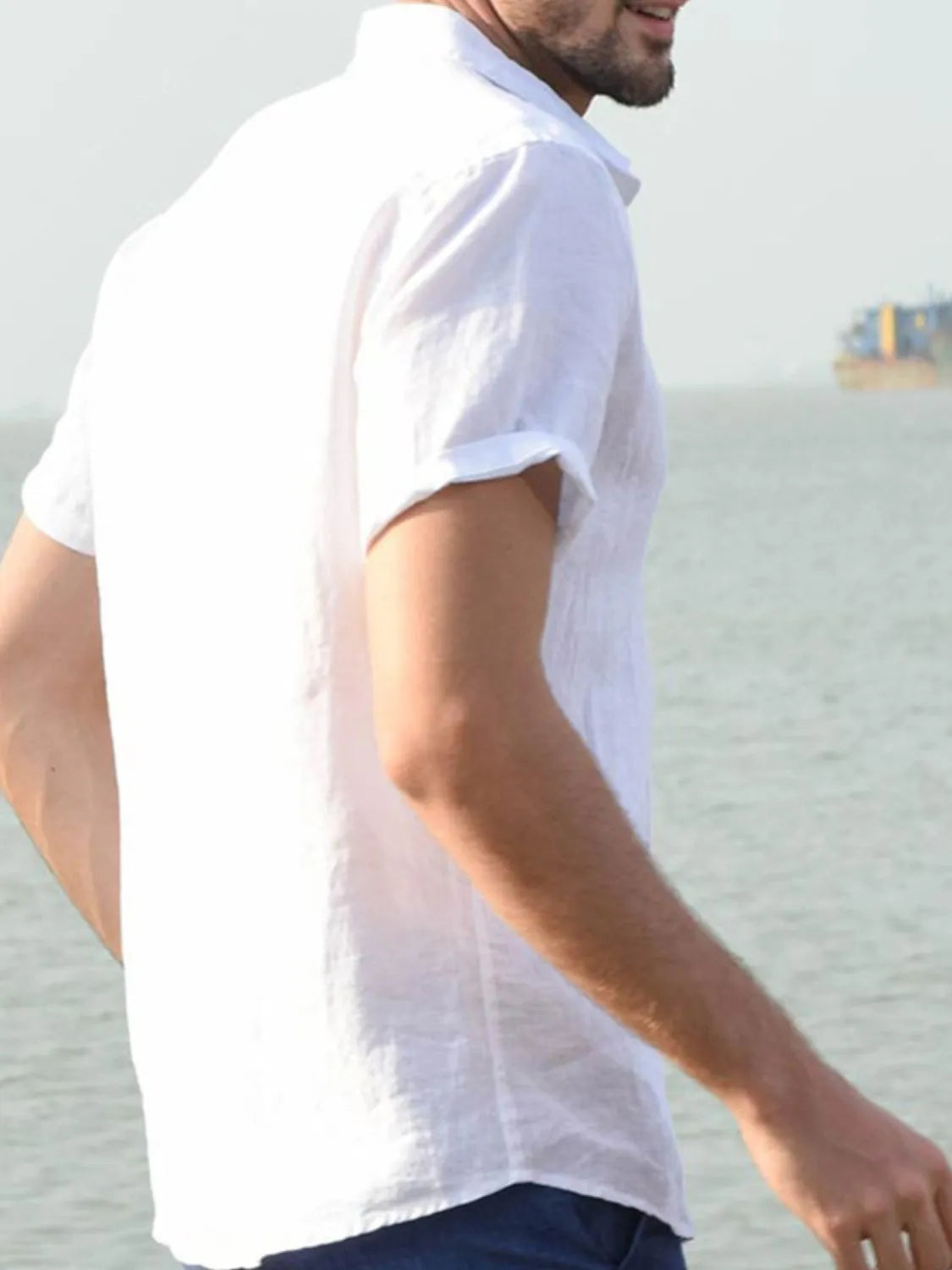 White linen resort shirt with short sleeves and a relaxed fit.