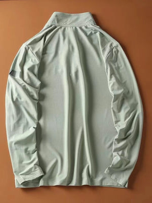 Light green quarter-zip long-sleeve sweatshirt with a textured fabric and a subtle detail on the left sleeve.