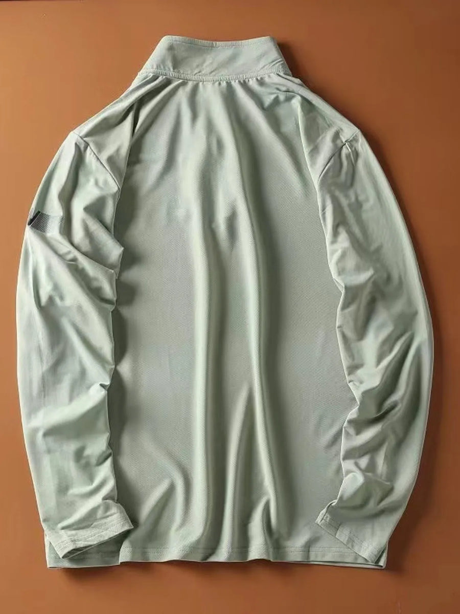 Light green quarter-zip long-sleeve sweatshirt with a textured fabric and a subtle detail on the left sleeve.