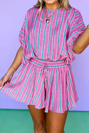 Vibrant stripe two-piece set with drawstring shorts and dolman sleeve top in fuchsia and teal.