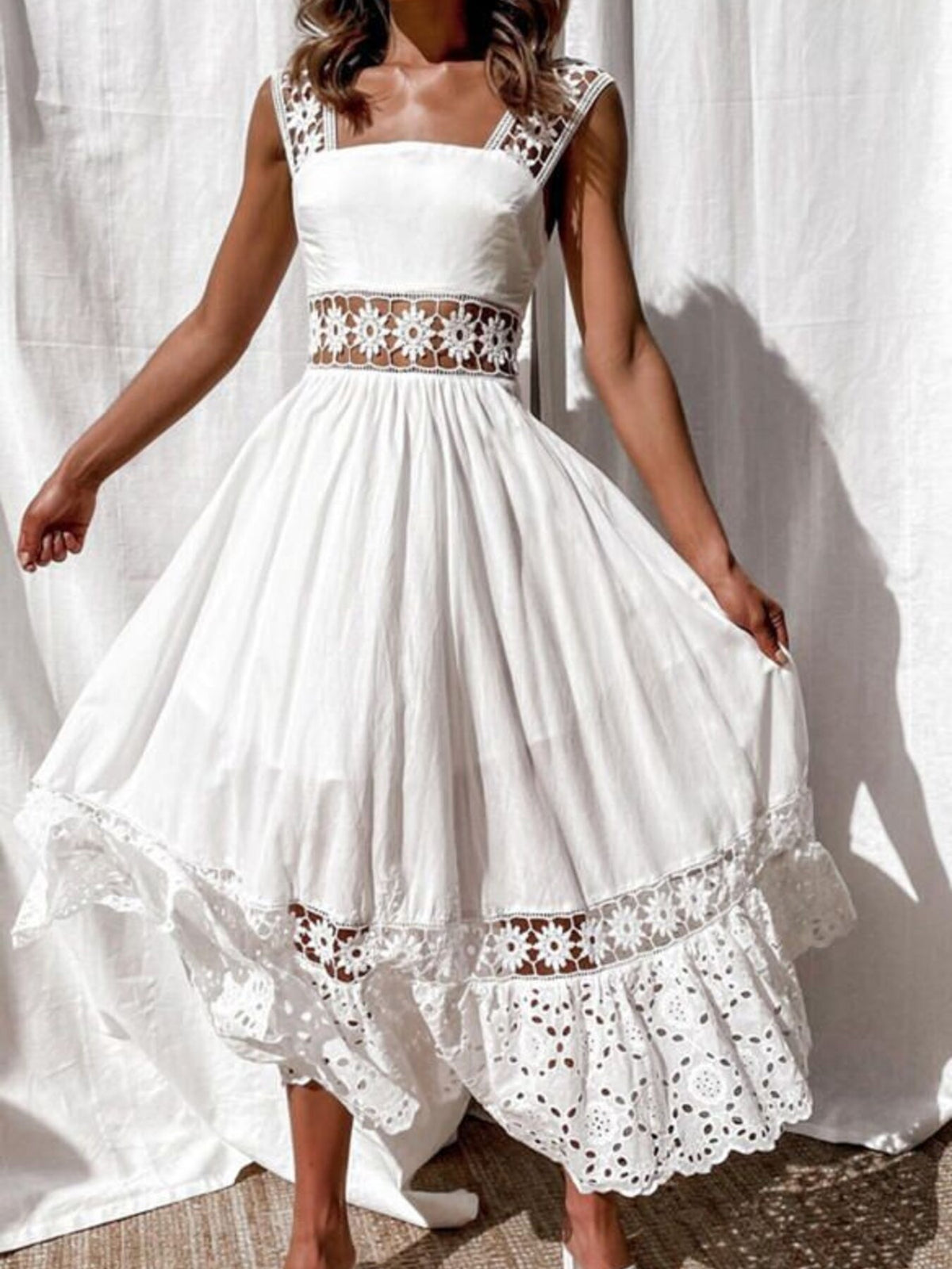 White openwork crochet sleeveless midi dress with cutout waist and tiered hem