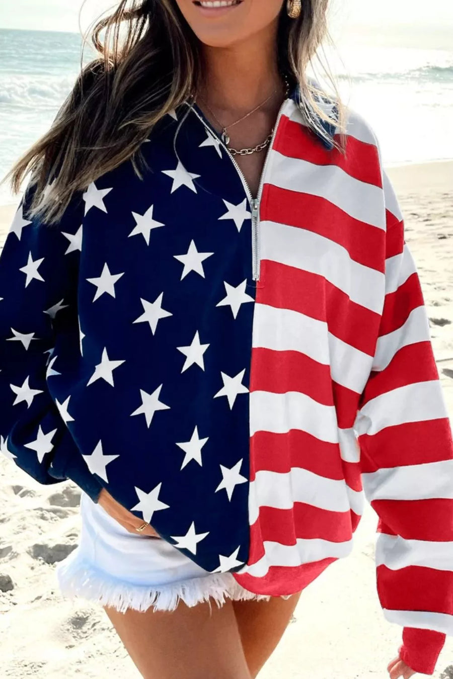 Patriotic print half-zip sweatshirt with stars and stripes, made of polyester.