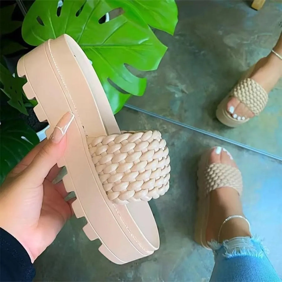 Cream woven platform slide sandals with braided strap detail and lug sole.