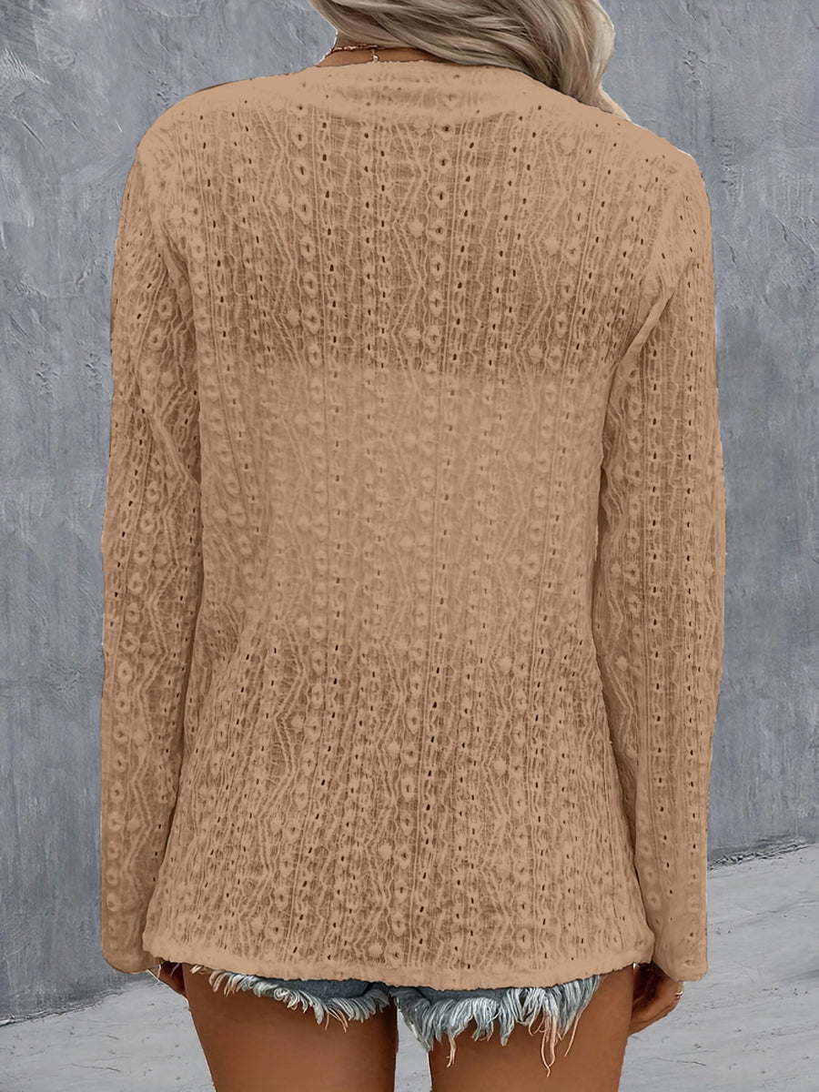 Camel open-weave long sleeve cardigan with intricate diamond pattern detail.