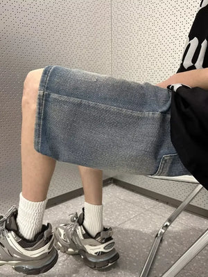 Men's vintage wash stretch denim shorts in light blue with a relaxed fit.