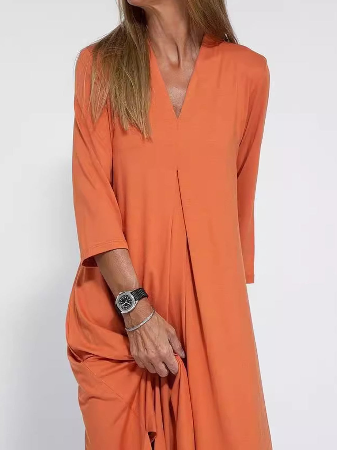 midi dress in orange featuring slit and relaxed fit