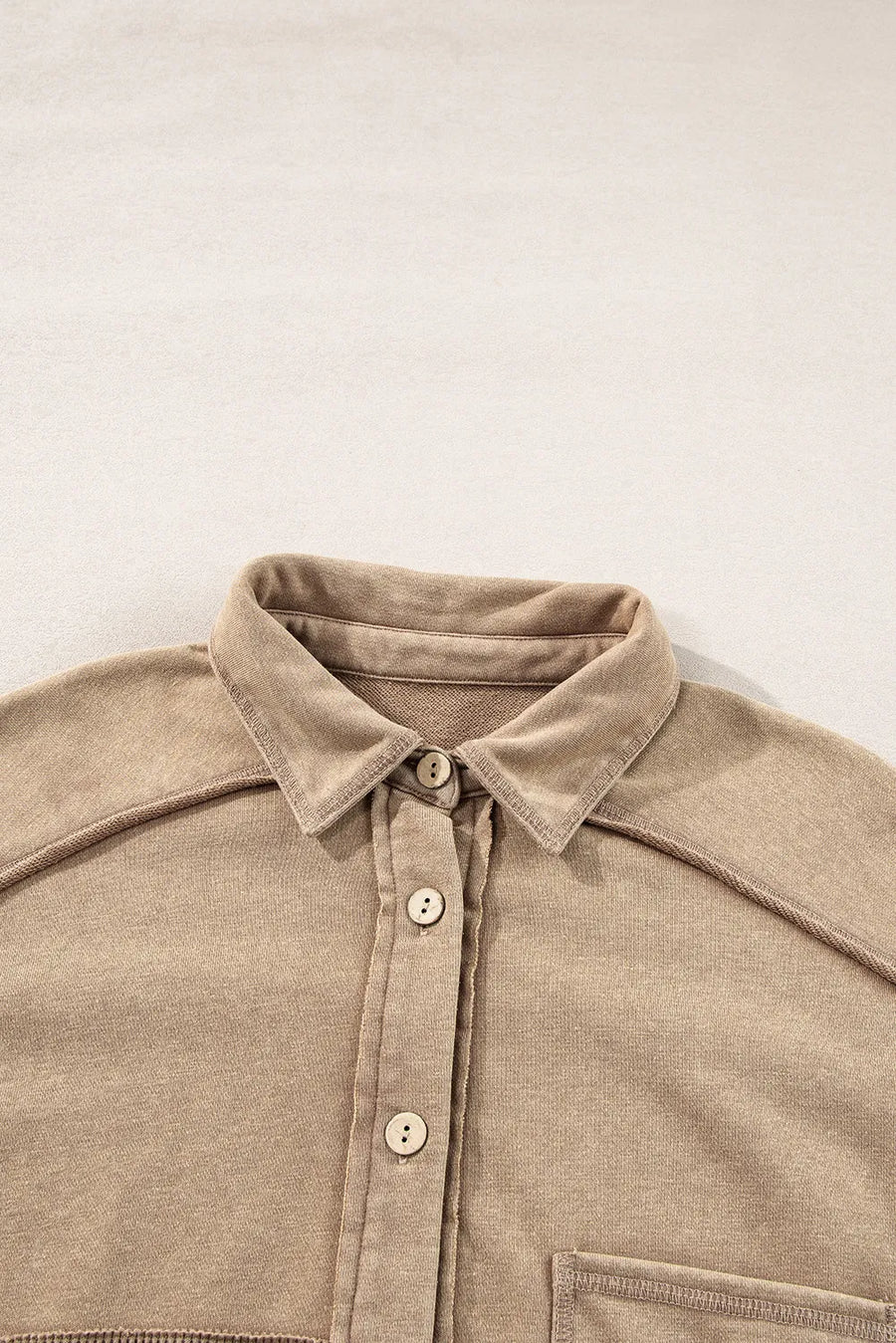 Tan waffle knit overshirt with collar, button front, and patch pocket detail.