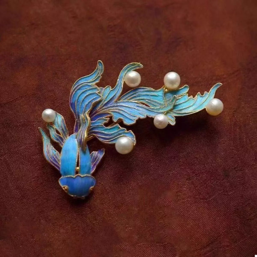 Blue goldfish dangle earrings with pearls and 18K gold plating.