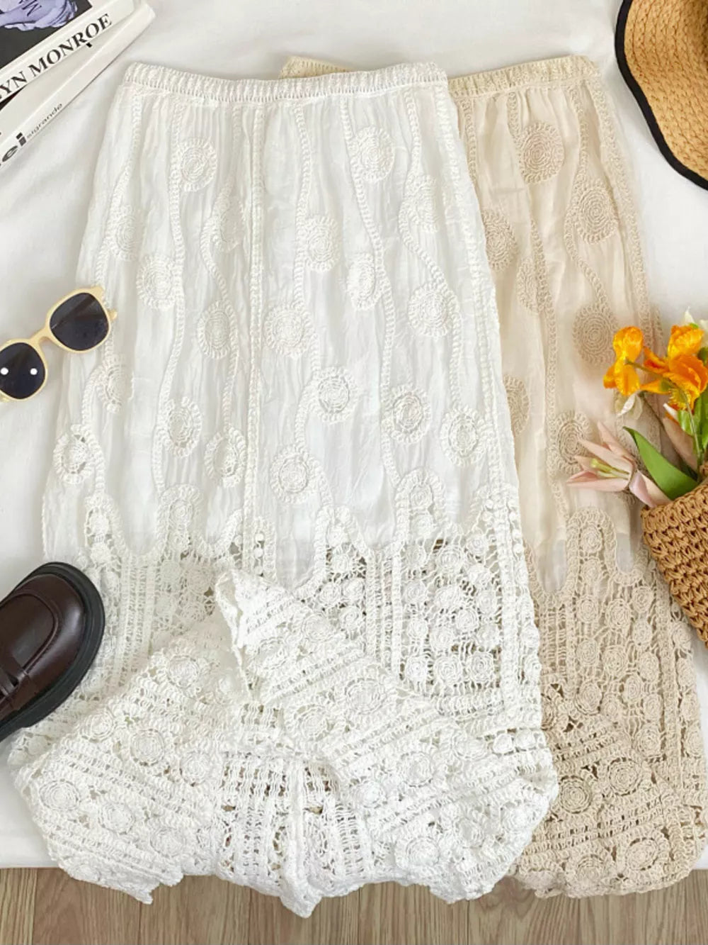 White lace midi skirt with crochet details and elastic waist, shown with apricot skirt.