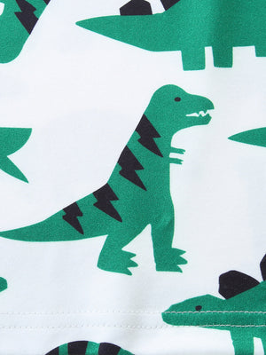 White cotton blend baby tee with green dinosaur print and black lightning details.