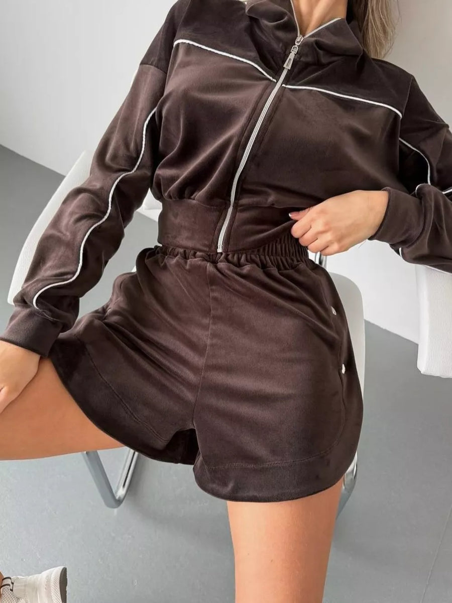 100% polyester Care instructions: Machine wash cold tracksuit in Black with relaxed silhouette