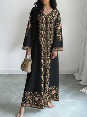 Black floral maxi dress with V-neck and long sleeves, featuring embroidered details.