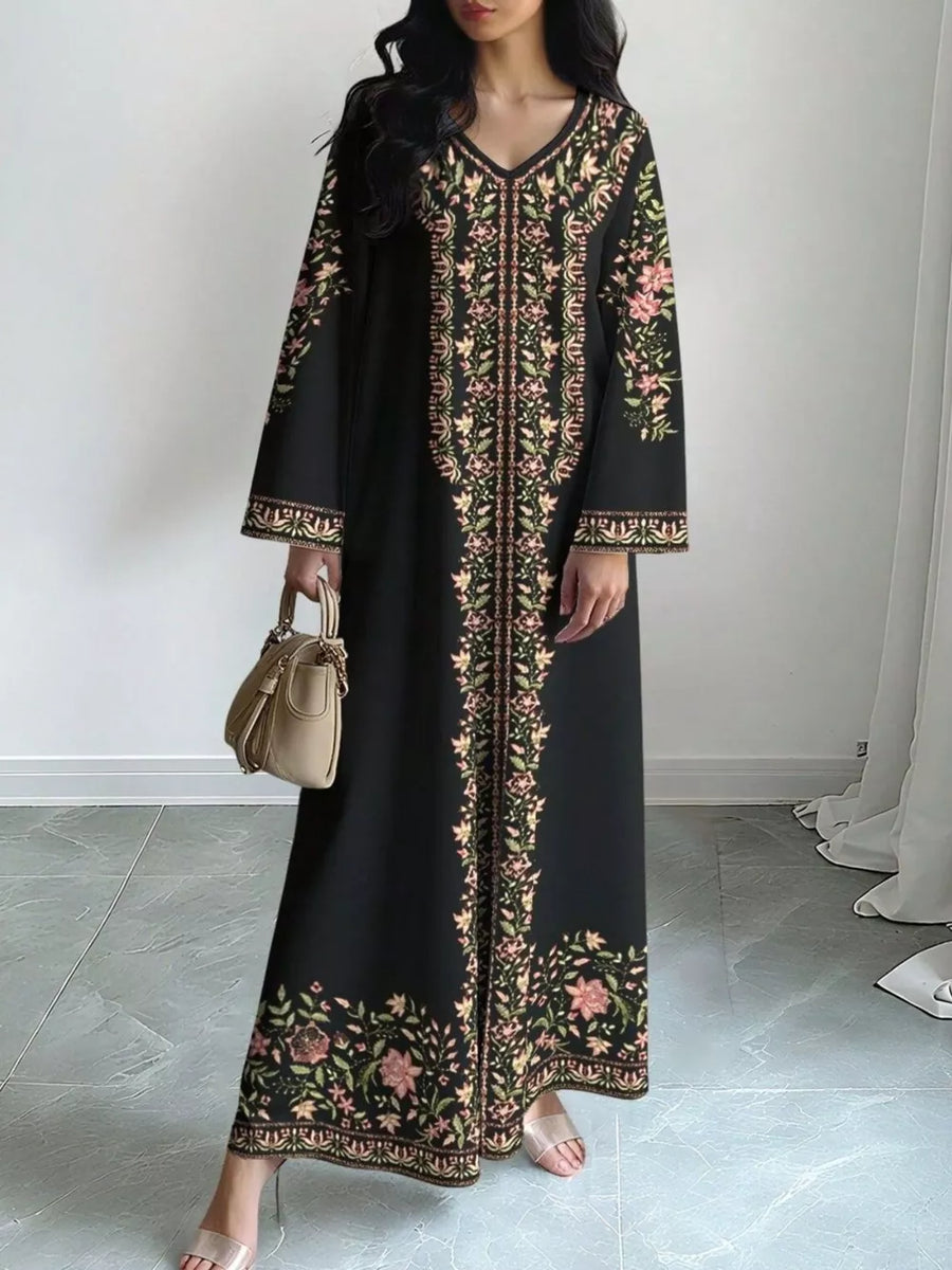Black floral maxi dress with V-neck and long sleeves, featuring embroidered details.