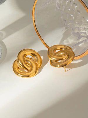 Interlocking gold statement earrings with bold, 18K gold-plated finish.
