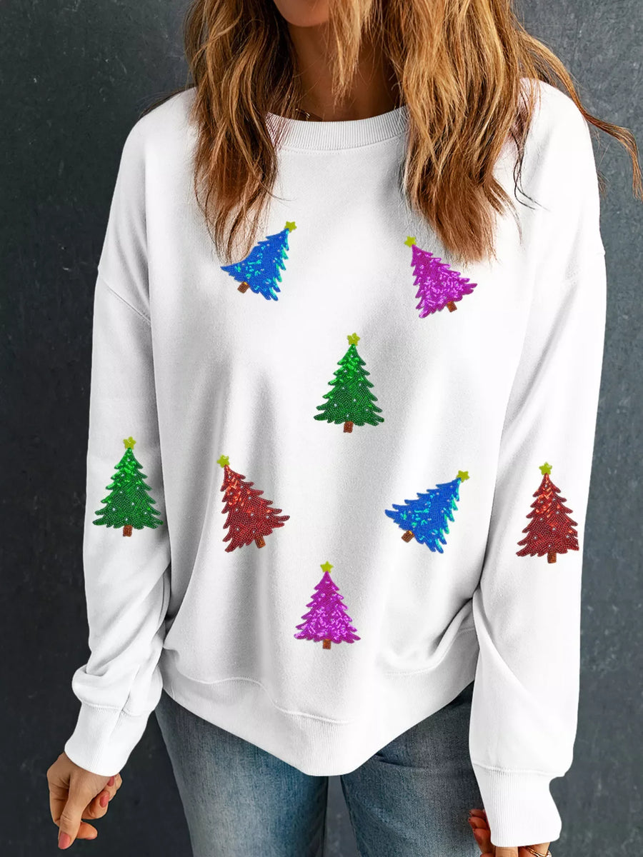 White sweatshirt with colorful sequin Christmas trees and stars.