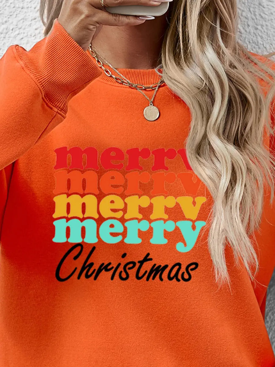 Orange graphic sweatshirt with retro Merry Christmas text in red, yellow, and teal.