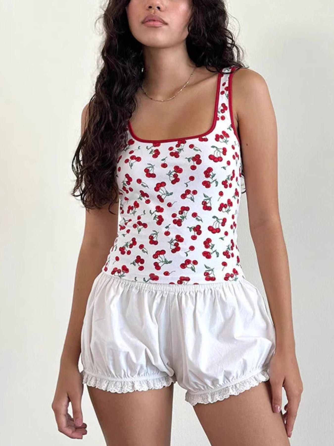 White square neck tank top with red cherry print and red trim