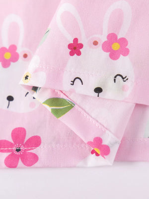 Pink cotton toddler dress with a cute bunny and floral print.