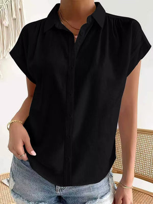 button-down shirt in black featuring collared and relaxed fit