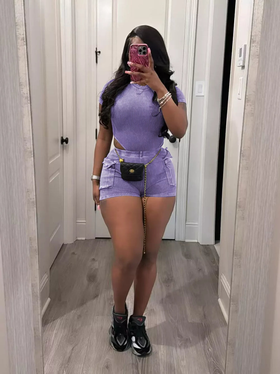 Purple ribbed crop top and shorts set with pockets and chain belt detail.