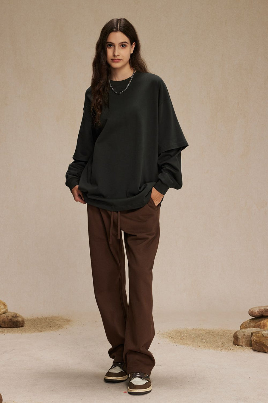 Dark grey layered long sleeve sweatshirt with brown drawstring pants