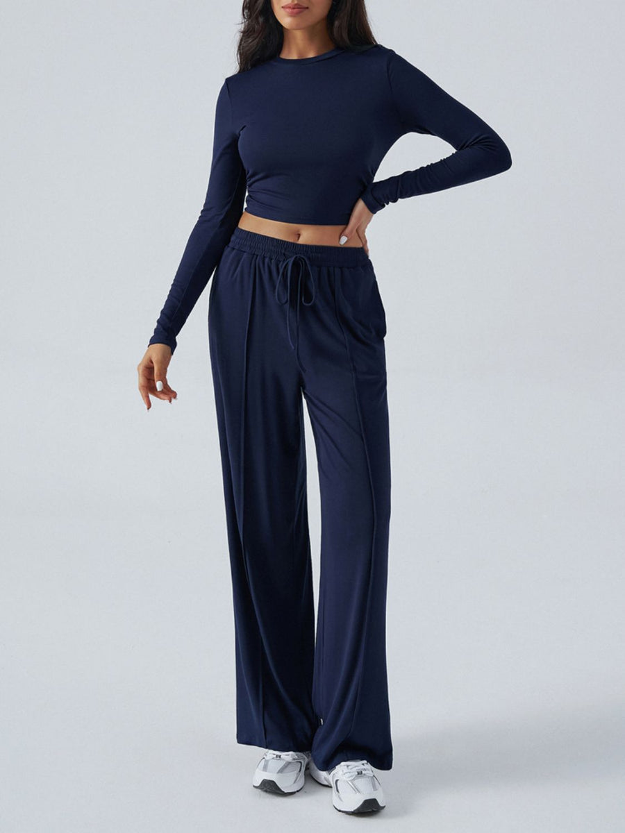 Dark blue ribbed knit crop top and wide leg pants set with drawstring waist.