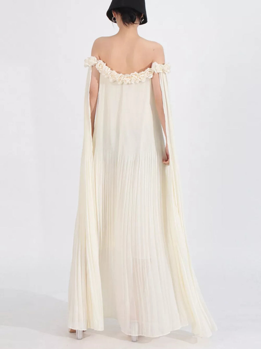 Elegant cream off-shoulder maxi dress with floral applique neckline and cape sleeves