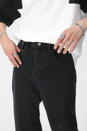 Wide-leg washed black denim trousers with a comfortable, casual fit.