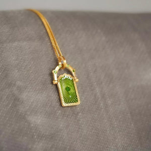 necklace featuring graphic in gold with 18K Gold-Plated,Resin,Titanium Steel Care instructions: Avoid wearing during exe