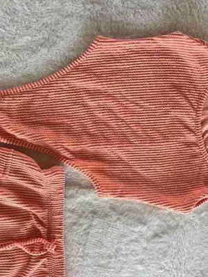 Coral striped textured one-shoulder bikini top with matching drawstring bottoms.