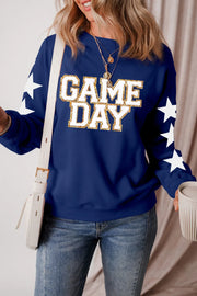 Navy sweatshirt with white stars on sleeves and "GAME DAY" glitter graphic.