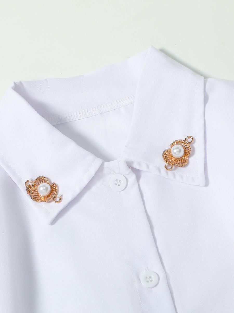 White button-down shirt dress with pearl and gold flower collar clips