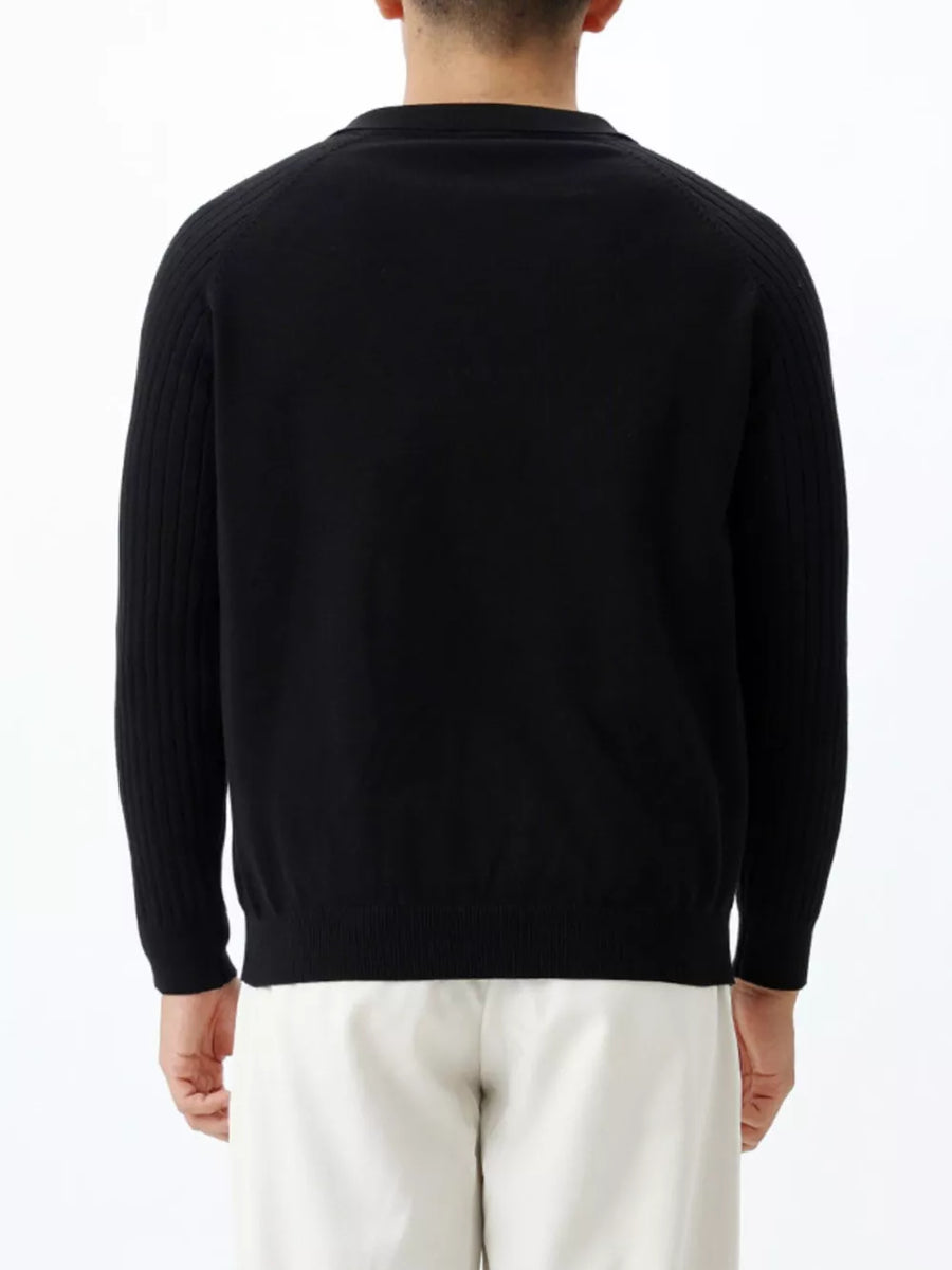 Men's black cotton knit top with ribbed sleeves and crew neck.