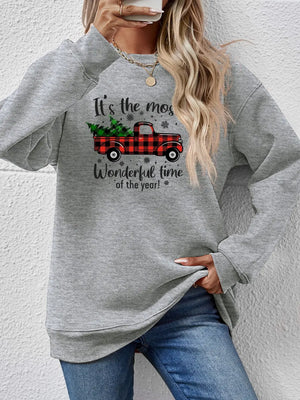 Grey sweatshirt with red buffalo plaid truck and Christmas tree graphic and text.