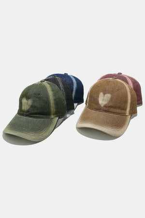 Bleached heart baseball cap in caramel and moss green with distressed details.