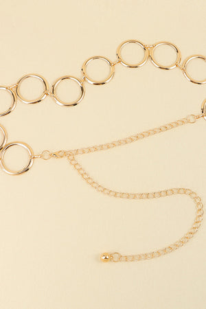 Gold geometric circle waist chain with delicate link chain and ball accent.