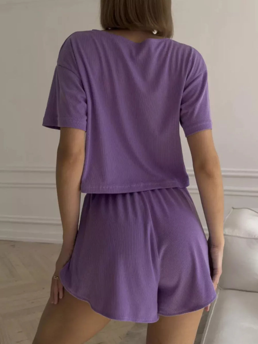 Purple ribbed knit cropped lounge set with shorts and a t-shirt.