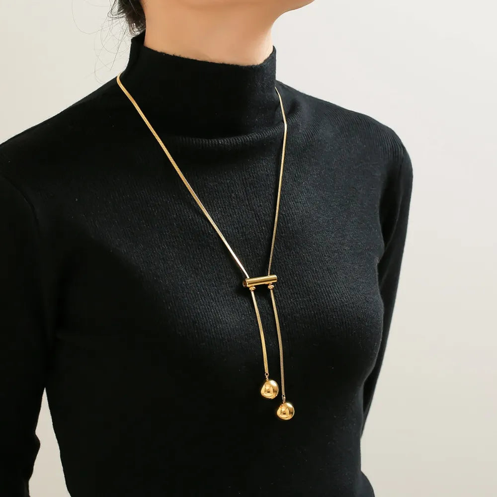 Gold lariat necklace with sphere drops and bar accent, 18K gold-plated