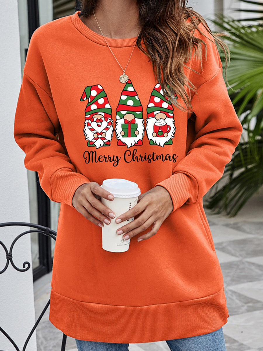 Orange tunic sweatshirt with Christmas gnomes and Merry Christmas graphic.