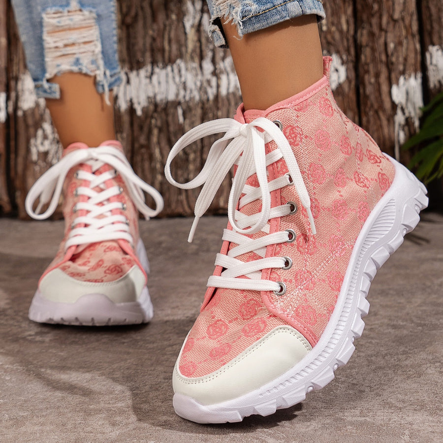 Pink canvas lace-up high-top sneakers with white toe cap and chunky sole.