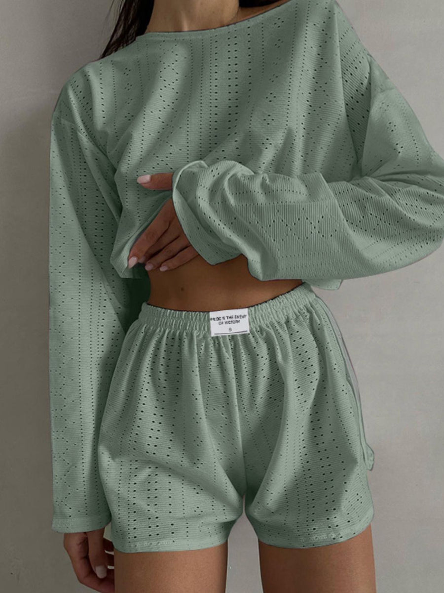 Matcha green perforated crop top and shorts set with a relaxed fit.