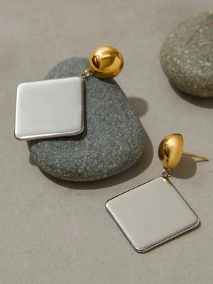 earrings in ivory with geometric design and medium length