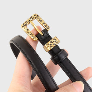 Black cowhide leather belt with ornate gold buckle and keeper.