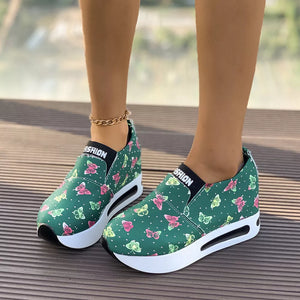 Green butterfly print slip-on flats with air cushion sole and chunky sole.