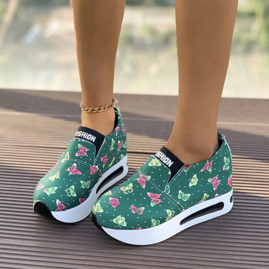 Green butterfly print slip-on flats with air cushion sole and chunky sole.