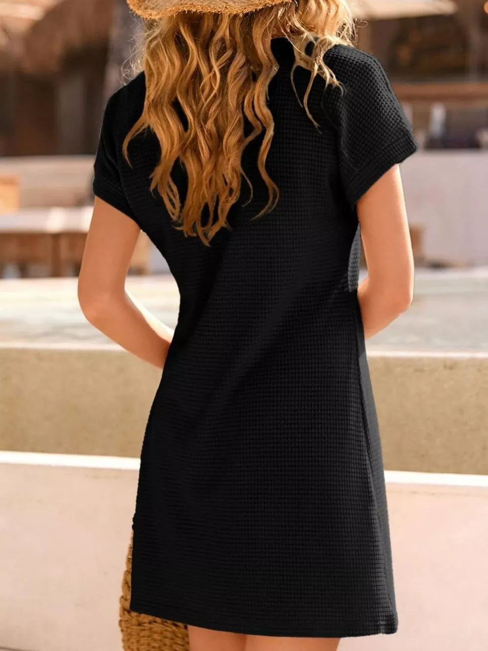 Black waffle knit dress with short sleeves and lace detail, a casual summer dress.