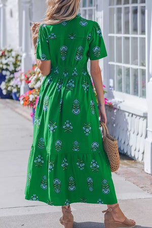 Green floral maxi dress with smocked waist and tiered skirt, short sleeves